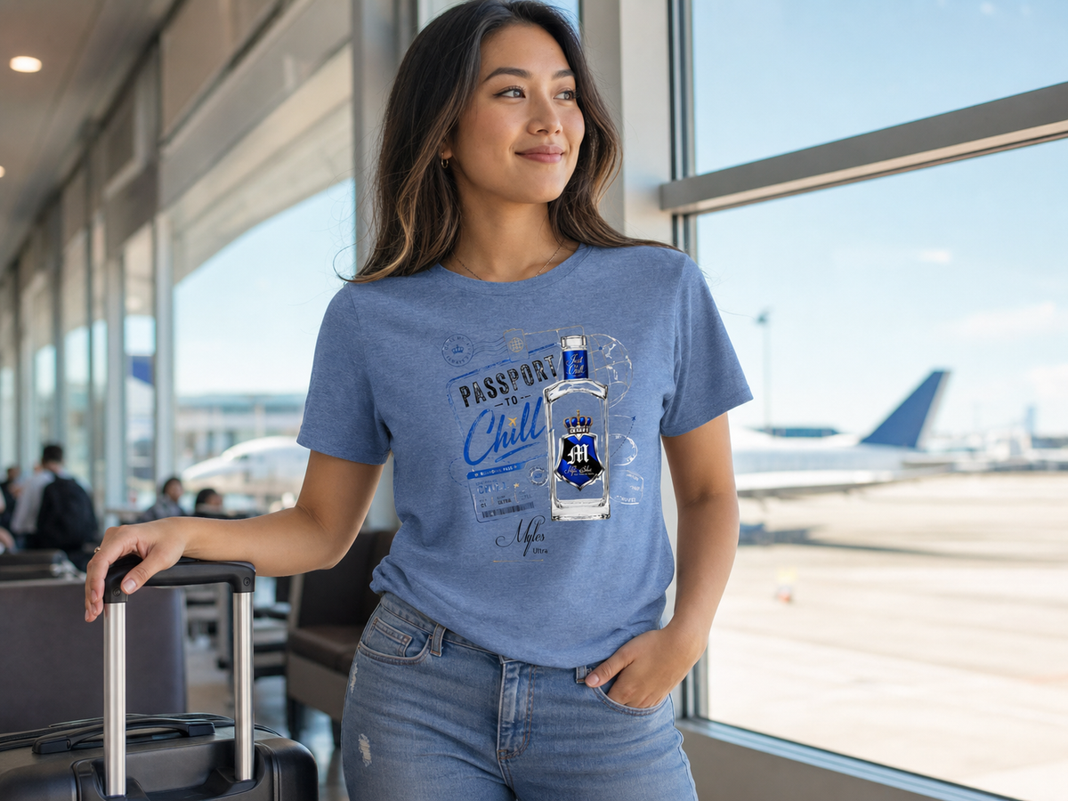 Passport to Chill tee lifestyle — model in airport lounge with suitcase